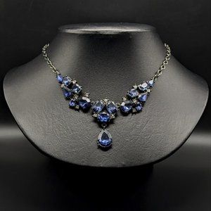 Blue Faceted Faux Crystal Necklace In Black Setting With Rhinestone Accents